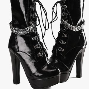 Black platform heels with chain, zip up, and laces